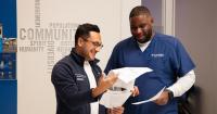Two Columbia Nursing students reviewing paperwork